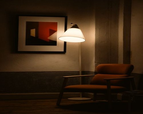 Cozy reading nook with warm lamp light